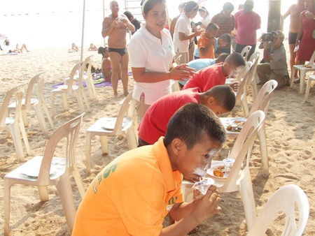 Youngsters literally stuff their faces during the speed eating contest.